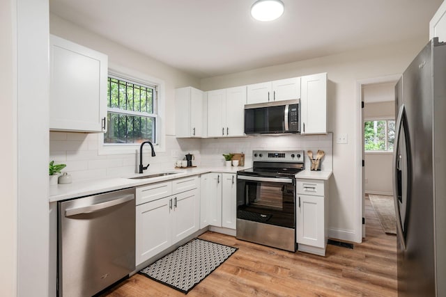 800 Campbell Ave, Columbus, OH 43222 - kitchen featuring stainless steel appliances, a sink, light countertops, and healthy amount of natural light