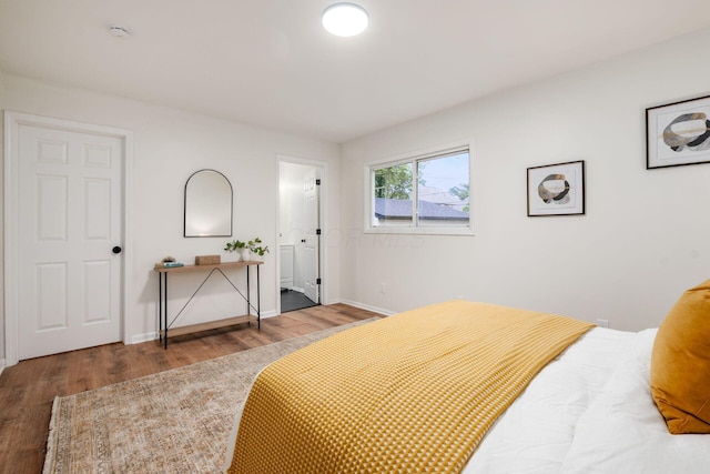 800 Campbell Ave, Columbus, OH 43222 - bedroom featuring wood finished floors, baseboards, and ensuite bath