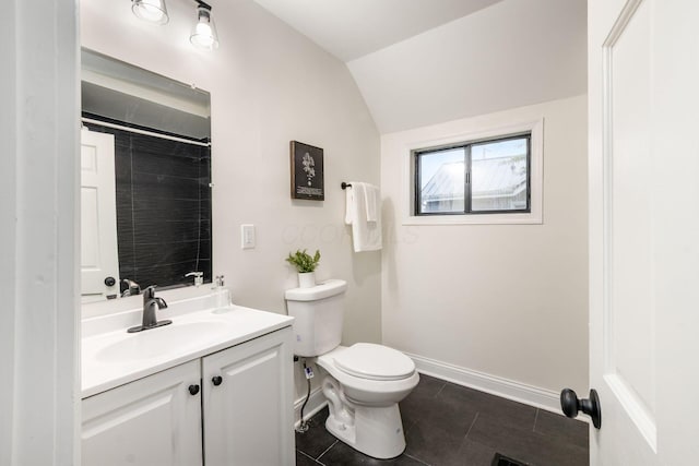 800 Campbell Ave, Columbus, OH 43222 - bathroom with lofted ceiling, vanity, toilet, tile patterned floors, and baseboards