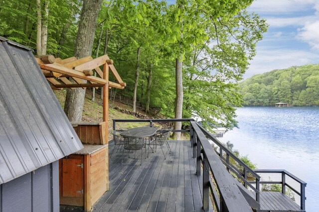 510 Natchez Ln, Sugar Grove, OH 43155 - deck featuring a water view, outdoor dining space, and a wooded view