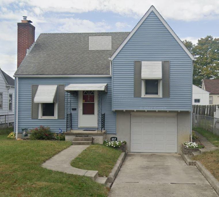 857 S Hague Ave, Columbus, OH 43204 - view of front of house featuring a chimney, a garage, roof with shingles, and driveway