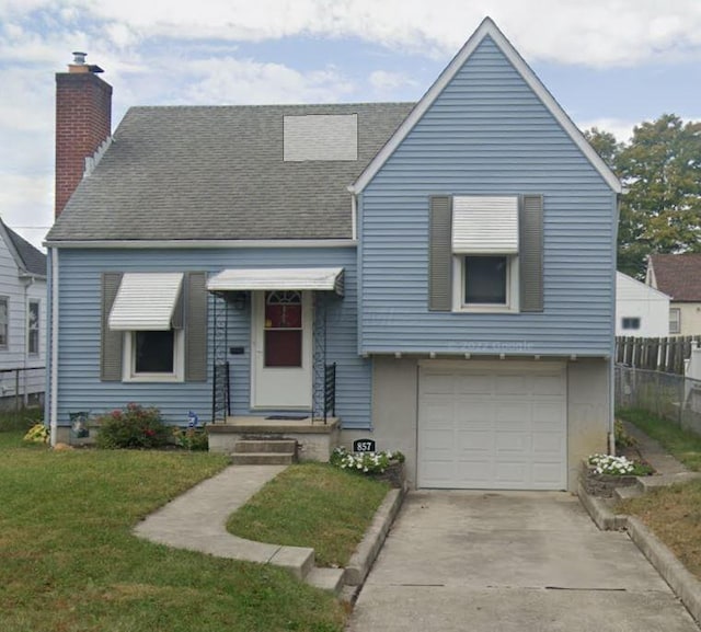 857 S Hague Ave, Columbus, OH 43204 - view of front of house featuring a chimney, a garage, roof with shingles, and driveway