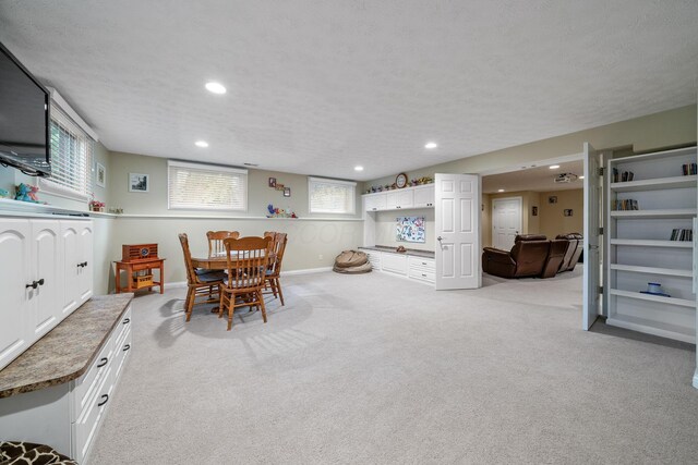 7607 Stone Ridge Dr, Springboro, OH 45066 - dining room with recessed lighting, light carpet, plenty of natural light, baseboards, and a textured ceiling