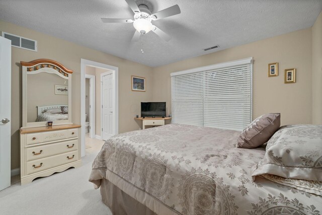 7607 Stone Ridge Dr, Springboro, OH 45066 - bedroom featuring light colored carpet, a textured ceiling, and a ceiling fan