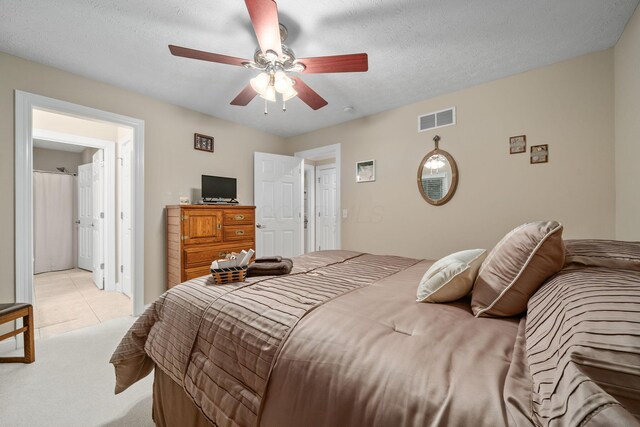 7607 Stone Ridge Dr, Springboro, OH 45066 - bedroom with light colored carpet, a ceiling fan, and light tile patterned floors