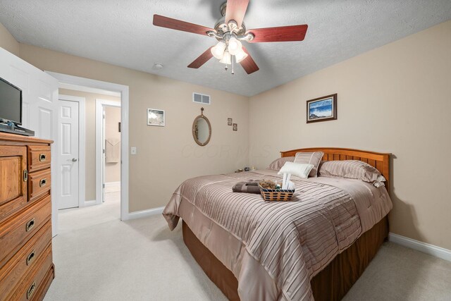 7607 Stone Ridge Dr, Springboro, OH 45066 - bedroom with light colored carpet, baseboards, a textured ceiling, and a ceiling fan