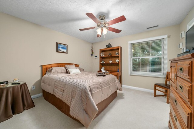 7607 Stone Ridge Dr, Springboro, OH 45066 - bedroom with light carpet, baseboards, a ceiling fan, and a textured ceiling
