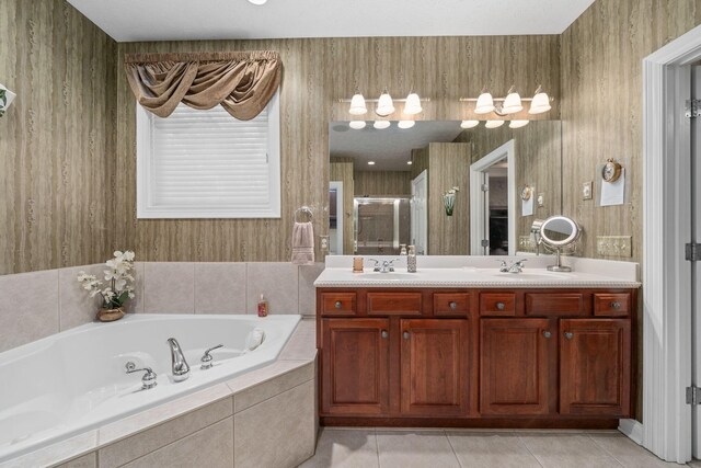 7607 Stone Ridge Dr, Springboro, OH 45066 - bathroom featuring a bath, double vanity, a stall shower, and tile patterned flooring