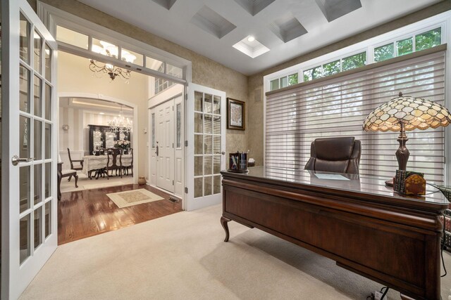 7607 Stone Ridge Dr, Springboro, OH 45066 - office area featuring a chandelier, coffered ceiling, french doors, arched walkways, and carpet