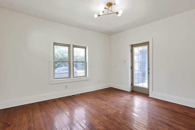 399 E Woodrow Ave, Columbus, OH 43207 - spare room with a chandelier, healthy amount of natural light, and hardwood / wood-style flooring