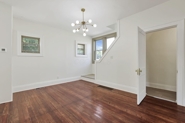 399 E Woodrow Ave, Columbus, OH 43207 - unfurnished dining area with a chandelier and wood-type flooring