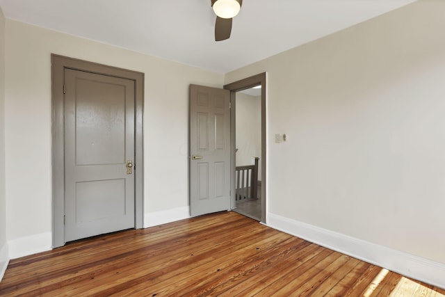 399 E Woodrow Ave, Columbus, OH 43207 - unfurnished bedroom featuring light wood finished floors and a ceiling fan