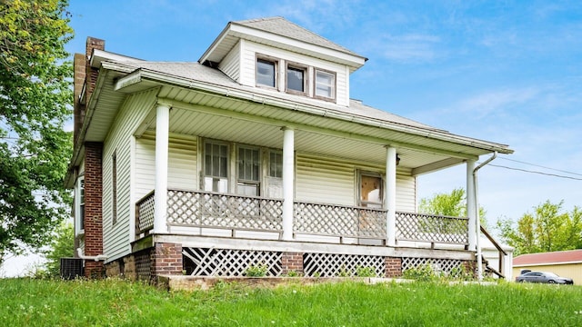 8045 Old Town Rd, Roseville, OH 43777 - view of front of home with a porch, a chimney, and a shingled roof
