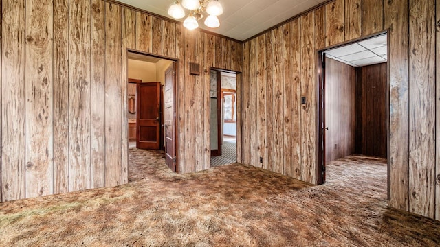 8045 Old Town Rd, Roseville, OH 43777 - empty room with wooden walls, carpet flooring, and a chandelier
