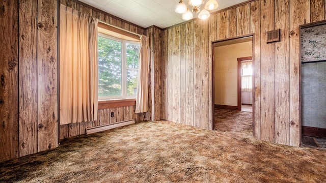 8045 Old Town Rd, Roseville, OH 43777 - unfurnished room featuring a baseboard radiator, carpet flooring, a chandelier, and wooden walls