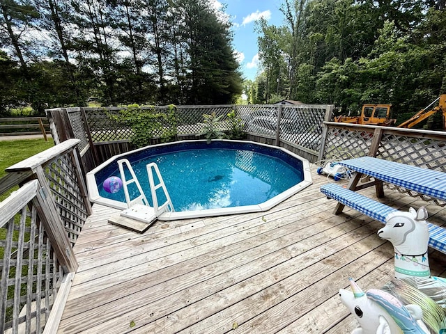 37855 Maysville Greendale Rd, Logan, OH 43138 - view of pool with a deck, a playground, and view of wooded area