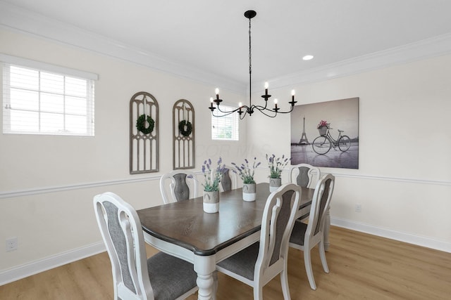 2618 Triple Crown Xing, Powell, OH 43065 - dining area featuring a chandelier, light wood-type flooring, ornamental molding, and baseboards