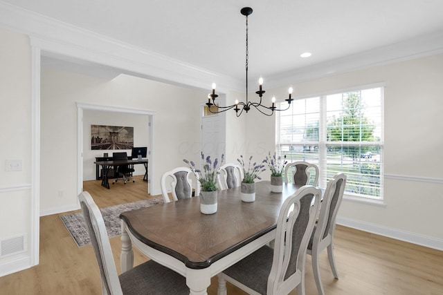 2618 Triple Crown Xing, Powell, OH 43065 - dining area with light wood-type flooring, a chandelier, ornamental molding, and baseboards