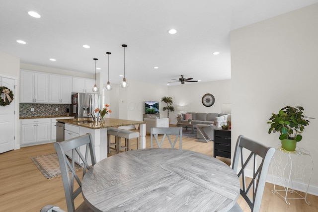 2618 Triple Crown Xing, Powell, OH 43065 - dining area featuring ceiling fan, light wood-style floors, recessed lighting, and baseboards