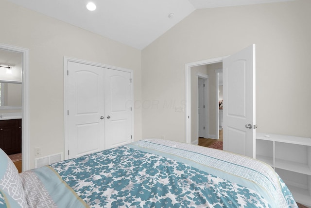 2618 Triple Crown Xing, Powell, OH 43065 - bedroom with lofted ceiling, a closet, ensuite bath, and baseboards