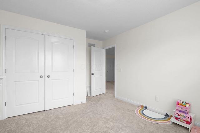 2618 Triple Crown Xing, Powell, OH 43065 - unfurnished bedroom with light colored carpet, baseboards, and a closet