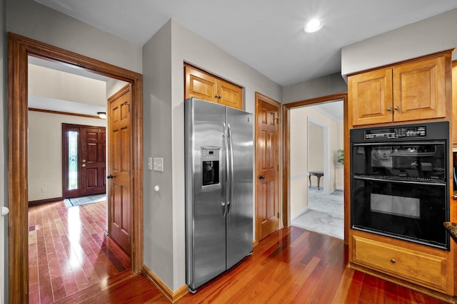 9440 Culross Ct, Dublin, OH 43017 - kitchen featuring stainless steel refrigerator with ice dispenser, hardwood / wood-style flooring, baseboards, and recessed lighting