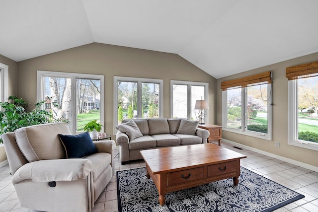 9440 Culross Ct, Dublin, OH 43017 - living area featuring vaulted ceiling, light tile patterned flooring, and baseboards
