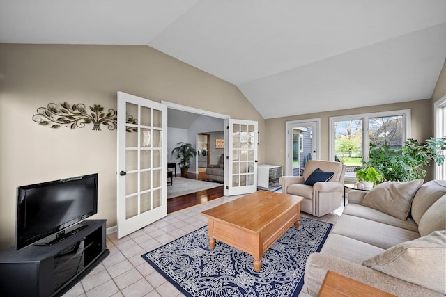 9440 Culross Ct, Dublin, OH 43017 - living room featuring french doors, vaulted ceiling, and light tile patterned floors