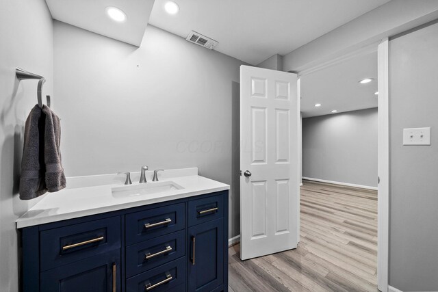 9440 Culross Ct, Dublin, OH 43017 - bathroom featuring wood finished floors, vanity, recessed lighting, and baseboards