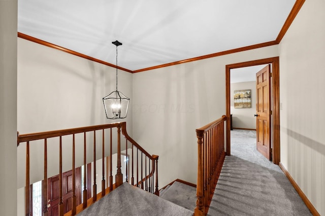 9440 Culross Ct, Dublin, OH 43017 - stairway featuring a chandelier, carpet floors, crown molding, and baseboards