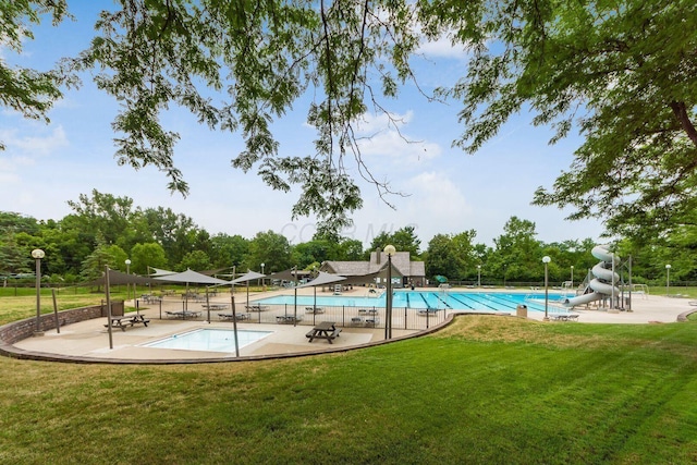 9440 Culross Ct, Dublin, OH 43017 - community pool featuring a water slide, a patio area, and view of scattered trees