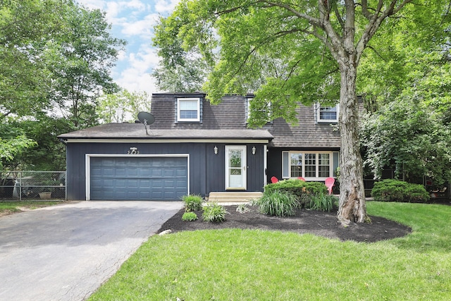 5255 Dory Ln, Columbus, OH 43235 - view of front of house with asphalt driveway, a shingled roof, and an attached garage