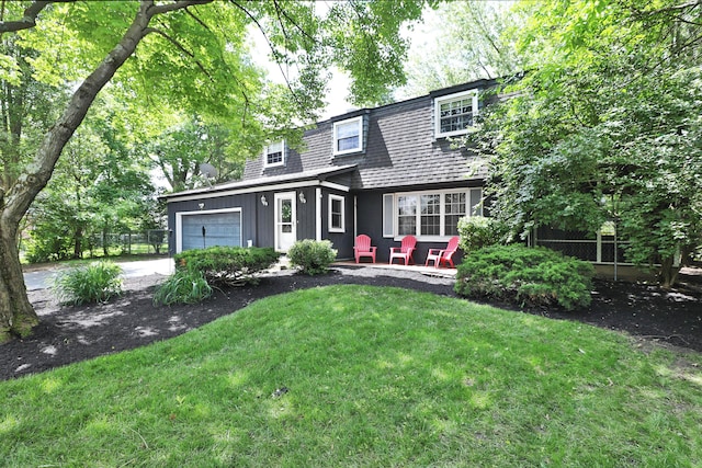 5255 Dory Ln, Columbus, OH 43235 - view of front facade with a garage, asphalt driveway, and a shingled roof