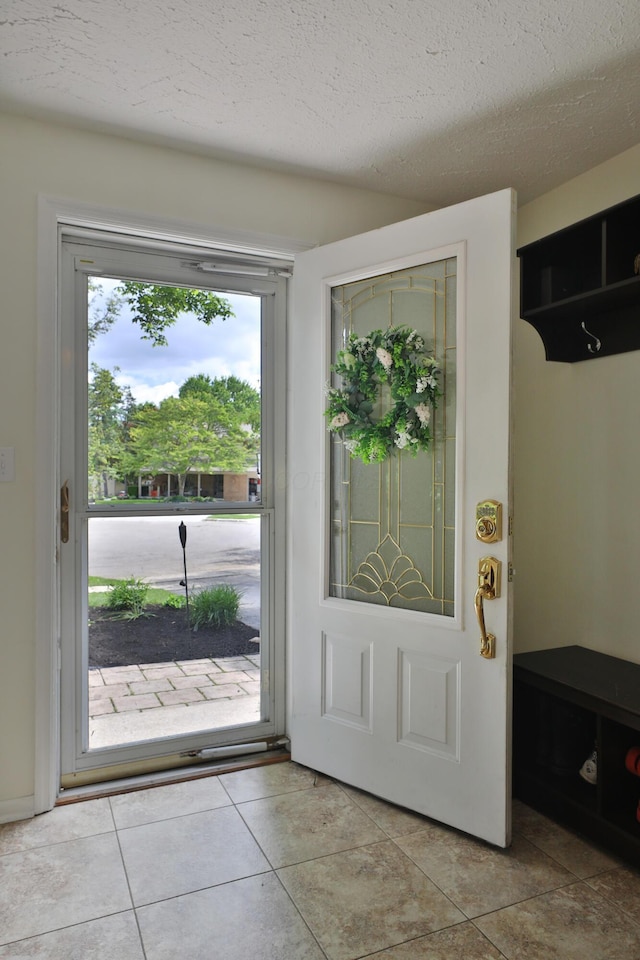 5255 Dory Ln, Columbus, OH 43235 - entrance foyer with a textured ceiling and light tile patterned floors