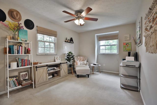 5255 Dory Ln, Columbus, OH 43235 - living area featuring light carpet, a ceiling fan, baseboards, and a textured ceiling