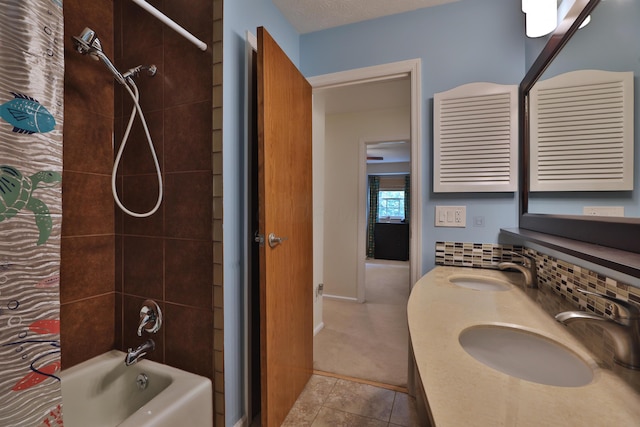 5255 Dory Ln, Columbus, OH 43235 - bathroom with shower / bath combo, tile patterned flooring, double vanity, and backsplash
