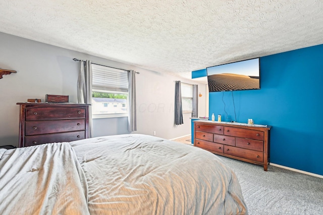 6588 Ethan Dr, Reynoldsburg, OH 43068 - carpeted bedroom featuring a textured ceiling and baseboards
