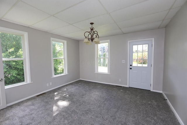 12 Montgomery Rd, Fredericktown, OH 43019 - unfurnished dining area featuring dark carpet, a paneled ceiling, healthy amount of natural light, and a chandelier