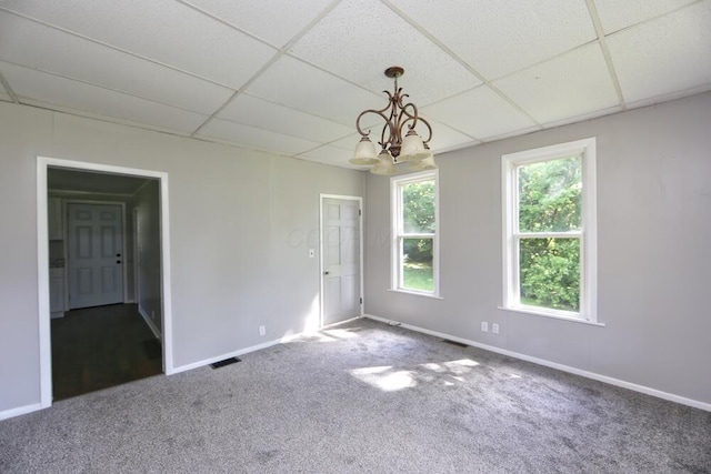 12 Montgomery Rd, Fredericktown, OH 43019 - unfurnished room with a drop ceiling, carpet, a chandelier, and baseboards