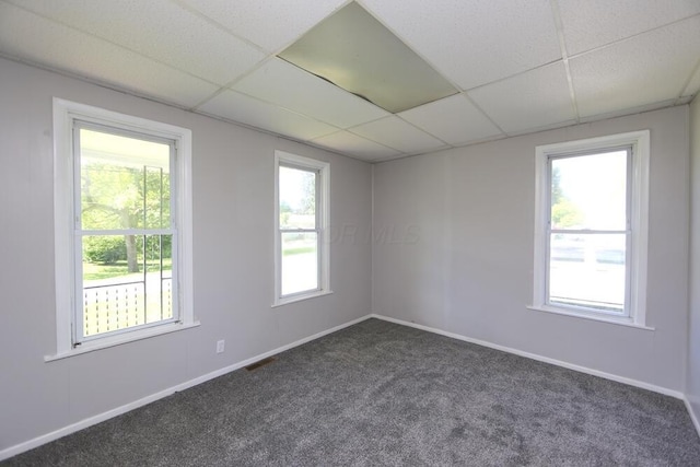 12 Montgomery Rd, Fredericktown, OH 43019 - unfurnished room featuring a drop ceiling, dark colored carpet, and baseboards