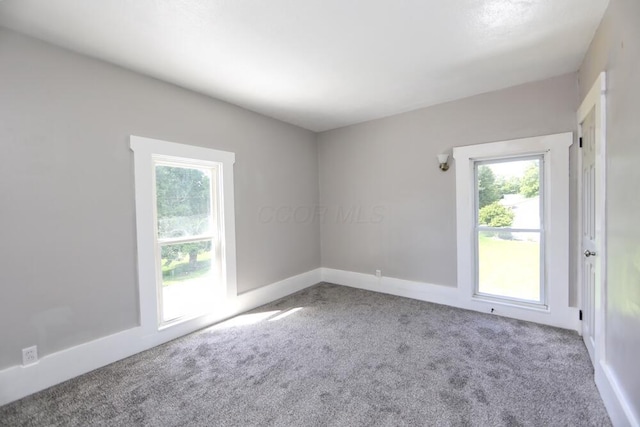 12 Montgomery Rd, Fredericktown, OH 43019 - spare room with carpet flooring, plenty of natural light, and baseboards