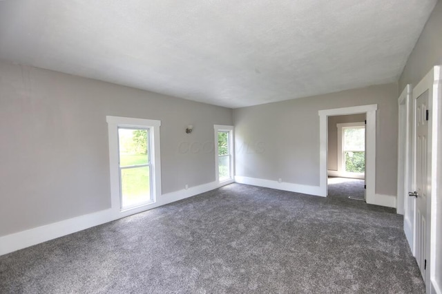 12 Montgomery Rd, Fredericktown, OH 43019 - spare room with dark carpet and baseboards