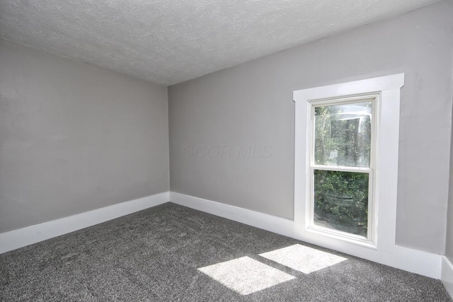 12 Montgomery Rd, Fredericktown, OH 43019 - carpeted spare room featuring a textured ceiling and baseboards