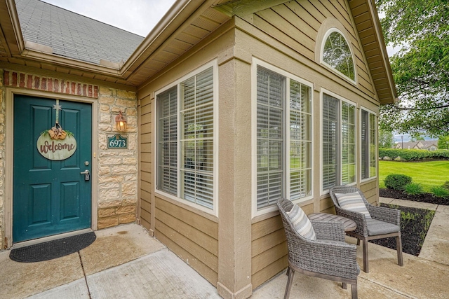 6973 Falls View Cir, Delaware, OH 43015 - view of exterior entry with roof with shingles