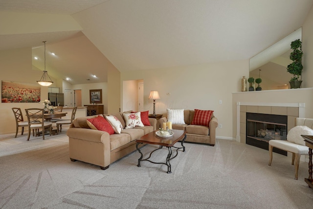 6973 Falls View Cir, Delaware, OH 43015 - living room with light colored carpet, baseboards, high vaulted ceiling, a tiled fireplace, and recessed lighting
