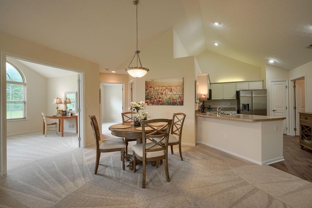 6973 Falls View Cir, Delaware, OH 43015 - dining room featuring light carpet, high vaulted ceiling, baseboards, and recessed lighting
