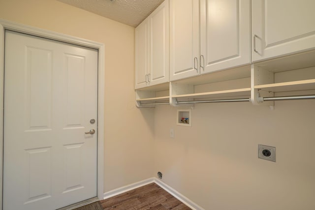 6973 Falls View Cir, Delaware, OH 43015 - laundry area with electric dryer hookup, cabinet space, hookup for a washing machine, dark wood finished floors, and baseboards