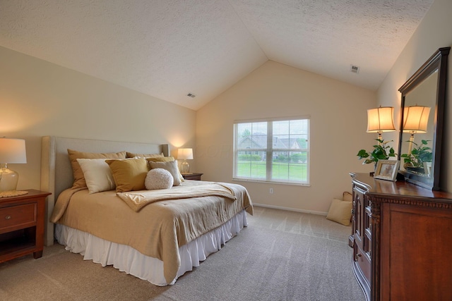 6973 Falls View Cir, Delaware, OH 43015 - bedroom with light carpet, lofted ceiling, a textured ceiling, and baseboards