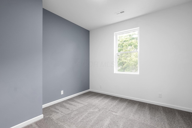 1191 Seymour Ave, Columbus, OH 43206 - carpeted empty room featuring baseboards