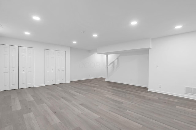 1191 Seymour Ave, Columbus, OH 43206 - finished basement featuring recessed lighting, baseboards, stairway, and light wood finished floors